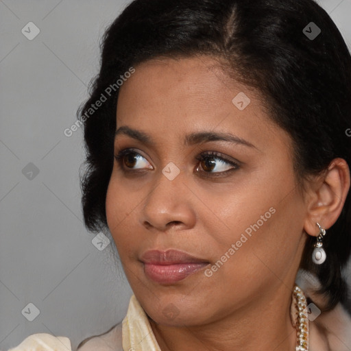 Joyful black young-adult female with medium  brown hair and brown eyes