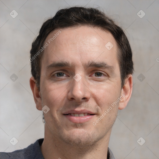 Joyful white adult male with short  brown hair and grey eyes