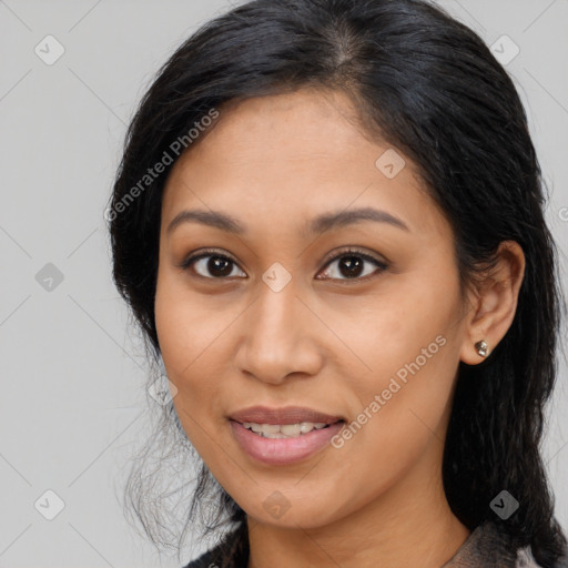 Joyful latino young-adult female with medium  brown hair and brown eyes