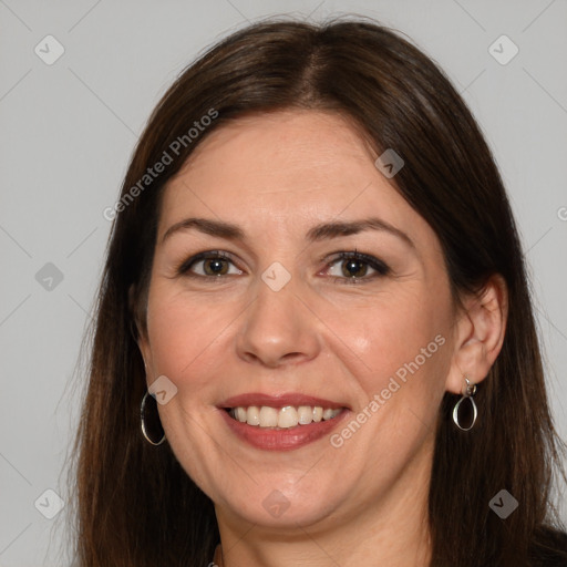 Joyful white adult female with long  brown hair and brown eyes