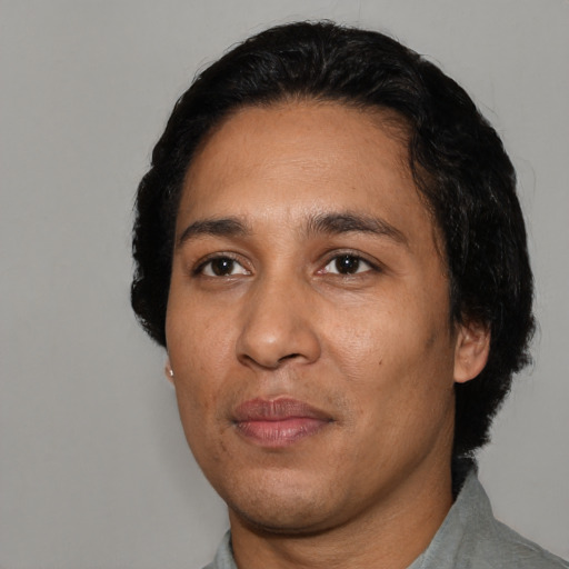 Neutral latino adult male with short  black hair and brown eyes