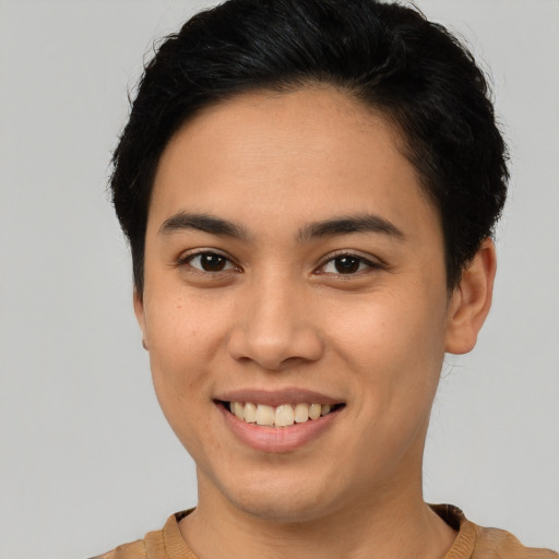 Joyful latino young-adult female with short  brown hair and brown eyes
