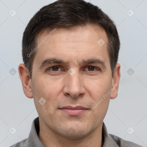 Joyful white adult male with short  brown hair and brown eyes