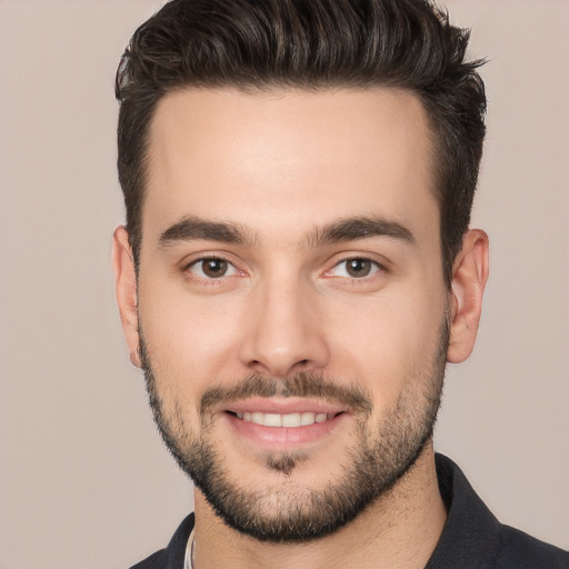 Joyful white young-adult male with short  black hair and brown eyes