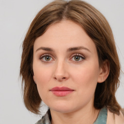 Neutral white young-adult female with medium  brown hair and green eyes