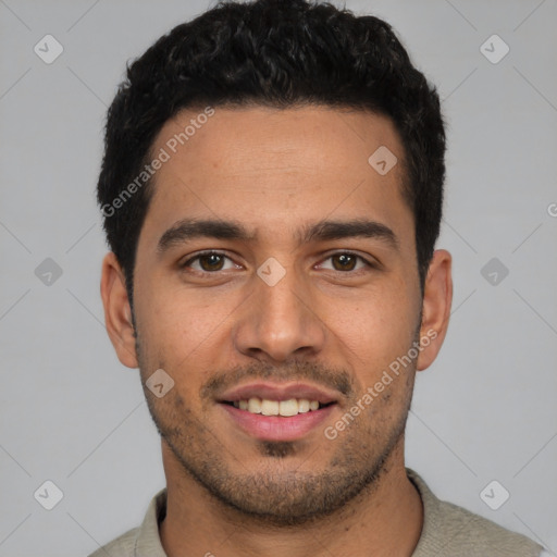 Joyful white young-adult male with short  black hair and brown eyes