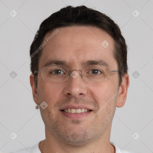 Joyful white adult male with short  brown hair and brown eyes