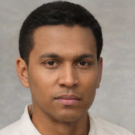 Neutral latino young-adult male with short  brown hair and brown eyes