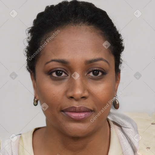 Joyful black young-adult female with short  brown hair and brown eyes