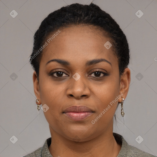 Joyful black young-adult female with short  black hair and brown eyes