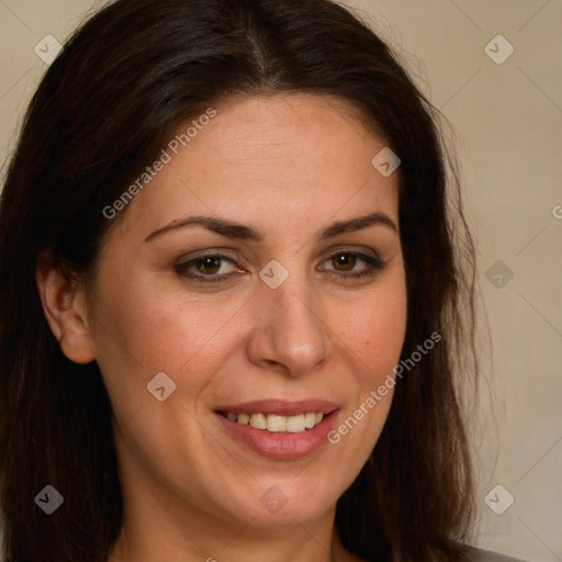 Joyful white adult female with long  brown hair and brown eyes