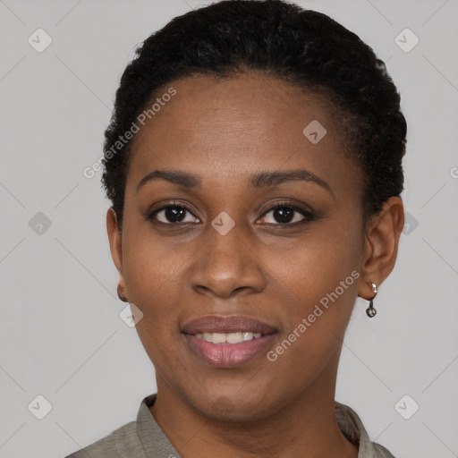 Joyful black young-adult female with short  black hair and brown eyes