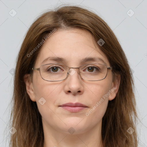 Joyful white adult female with long  brown hair and grey eyes