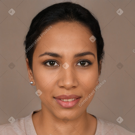 Joyful latino young-adult female with short  black hair and brown eyes