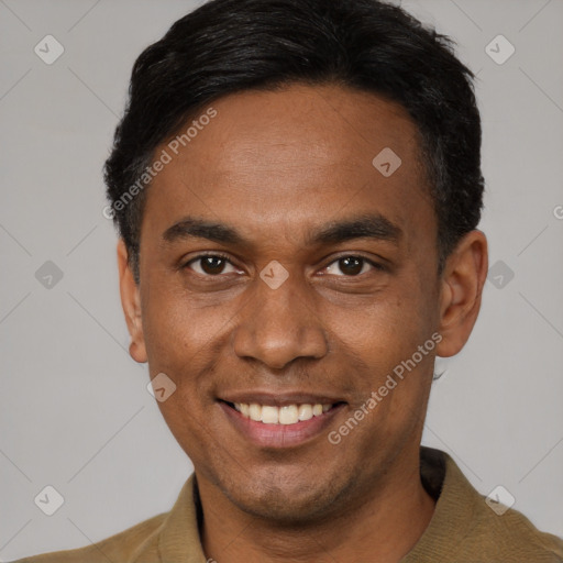 Joyful latino young-adult male with short  black hair and brown eyes