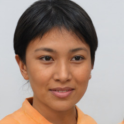 Joyful asian young-adult female with short  brown hair and brown eyes