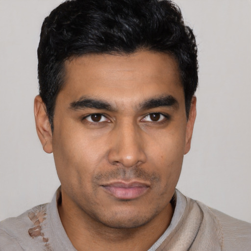 Neutral latino young-adult male with short  black hair and brown eyes