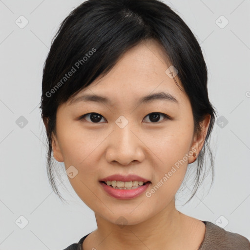 Joyful asian young-adult female with medium  black hair and brown eyes