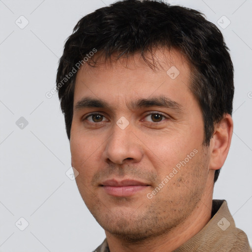 Joyful white young-adult male with short  black hair and brown eyes