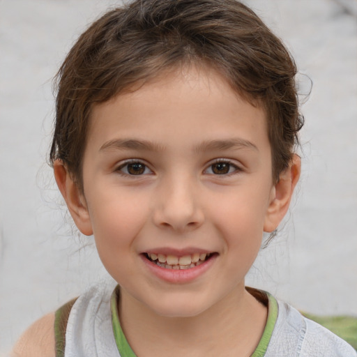 Joyful white child female with short  brown hair and brown eyes