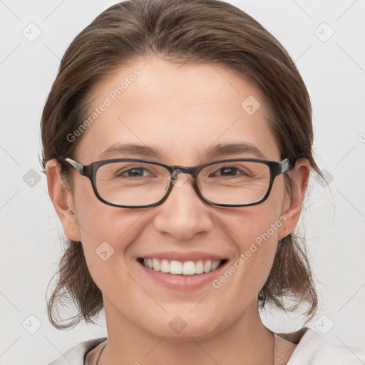 Joyful white young-adult female with medium  brown hair and grey eyes