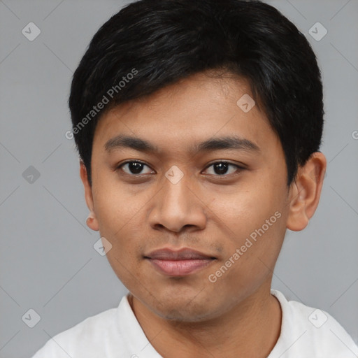 Joyful asian young-adult male with short  black hair and brown eyes