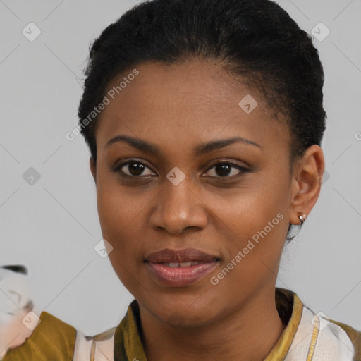 Joyful black young-adult female with short  brown hair and brown eyes