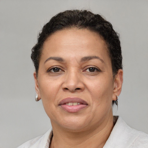 Joyful white adult female with short  brown hair and brown eyes