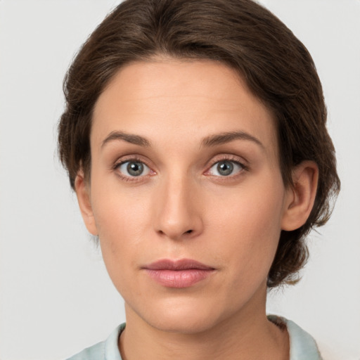 Neutral white young-adult female with medium  brown hair and grey eyes