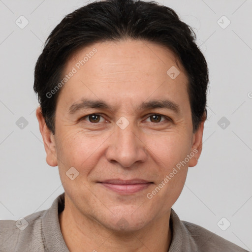 Joyful white adult male with short  brown hair and brown eyes