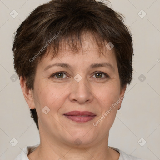 Joyful white adult female with short  brown hair and brown eyes