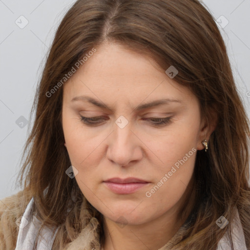 Joyful white adult female with long  brown hair and brown eyes