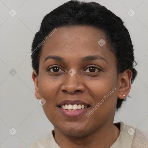 Joyful black young-adult female with short  brown hair and brown eyes