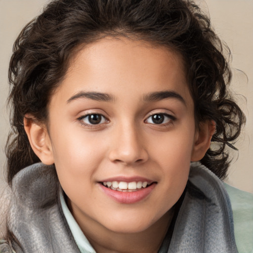 Joyful white child female with medium  brown hair and brown eyes