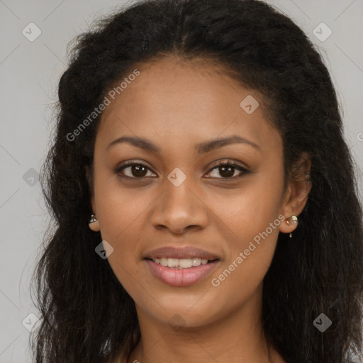 Joyful black young-adult female with long  brown hair and brown eyes