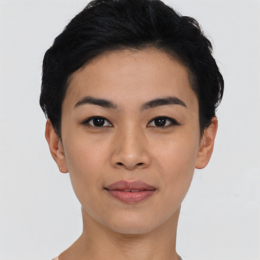 Joyful asian young-adult female with short  black hair and brown eyes