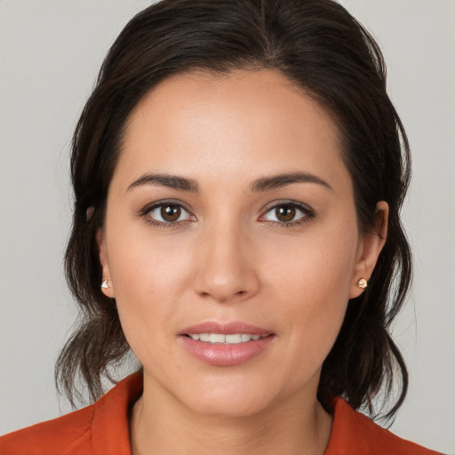 Joyful white young-adult female with medium  brown hair and brown eyes