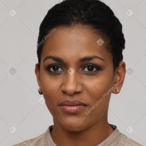 Joyful black young-adult female with short  black hair and brown eyes
