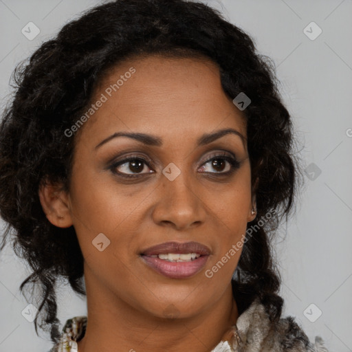 Joyful black young-adult female with long  brown hair and brown eyes