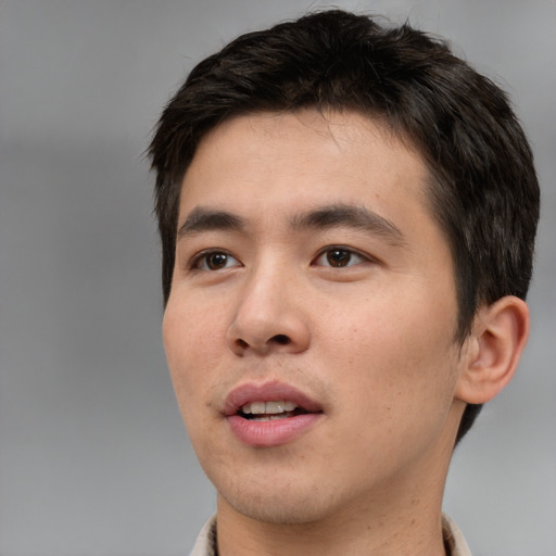 Neutral asian young-adult male with short  brown hair and brown eyes