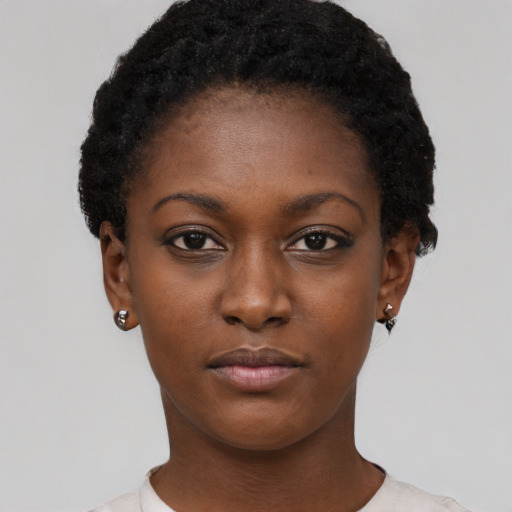 Neutral black young-adult female with short  black hair and brown eyes
