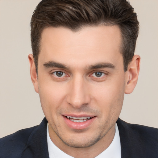 Joyful white young-adult male with short  brown hair and brown eyes