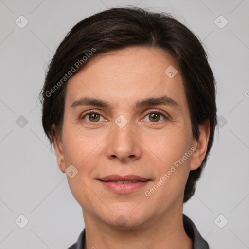 Joyful white adult female with short  brown hair and brown eyes