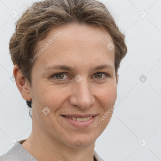 Joyful white adult female with short  brown hair and grey eyes