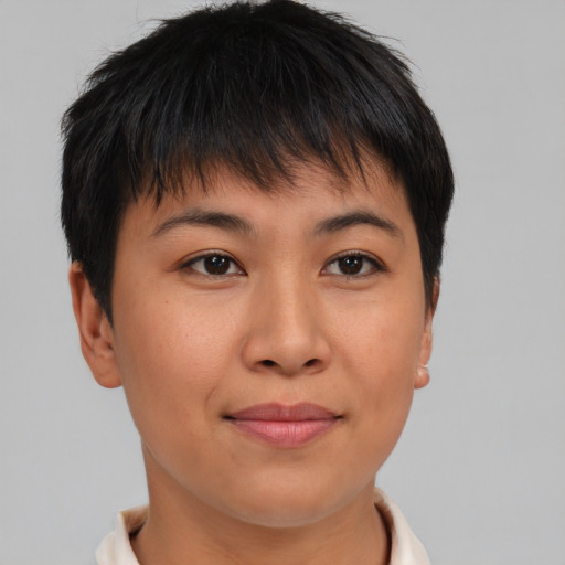 Joyful asian young-adult female with short  brown hair and brown eyes