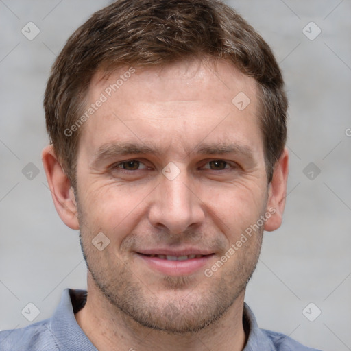 Joyful white adult male with short  brown hair and grey eyes