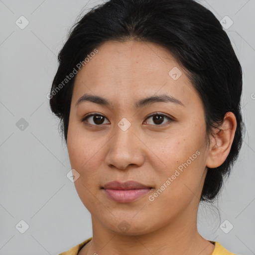 Joyful asian young-adult female with medium  brown hair and brown eyes