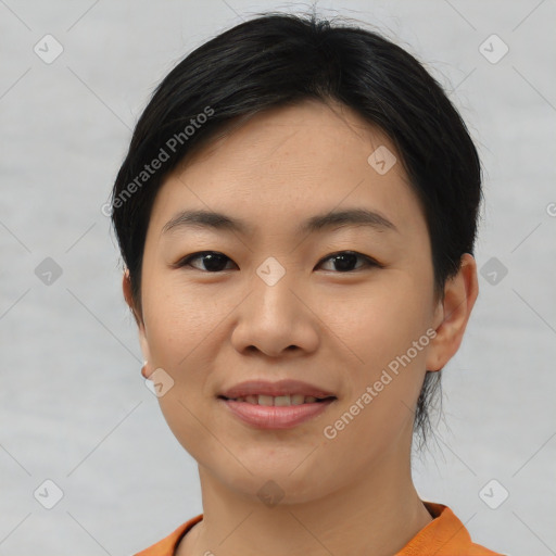 Joyful asian young-adult female with short  black hair and brown eyes