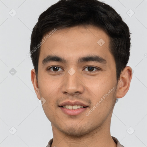 Joyful white young-adult male with short  black hair and brown eyes