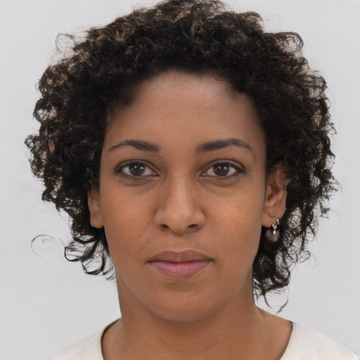 Neutral black young-adult female with short  brown hair and brown eyes